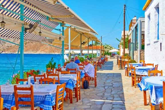 Perdika, Aegina Island, Greece Open-air seafood waterfront restaurant in Aegina, Greece
