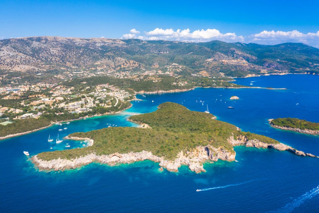 The Sivota islets on the Ionian coast from the air, green islands in sheltered blue water