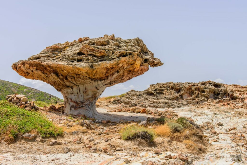 Skiadi stone - a giant lump in the shape of a mushroom, a unique natural attraction of the island of Kimolos, Cyclades, Greece.-min.
