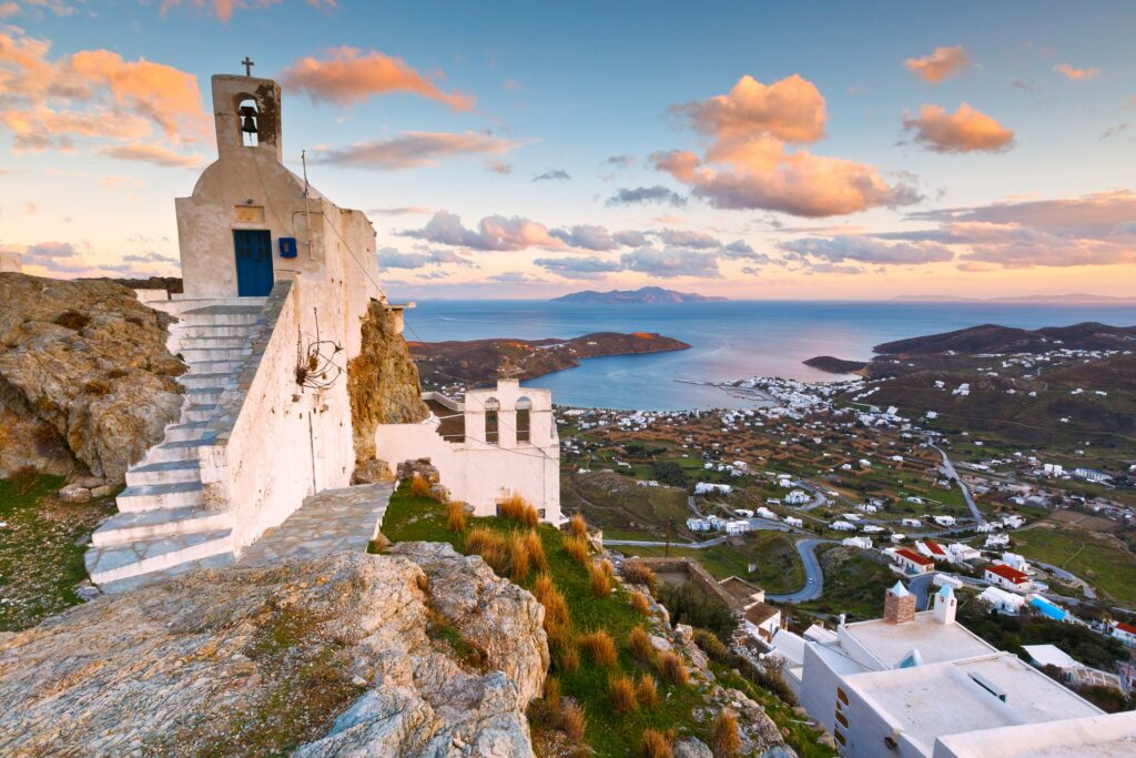 View of the harbor, Livadi village and Sifnos island in the distance from Chora, Serifos island in Greece-min.