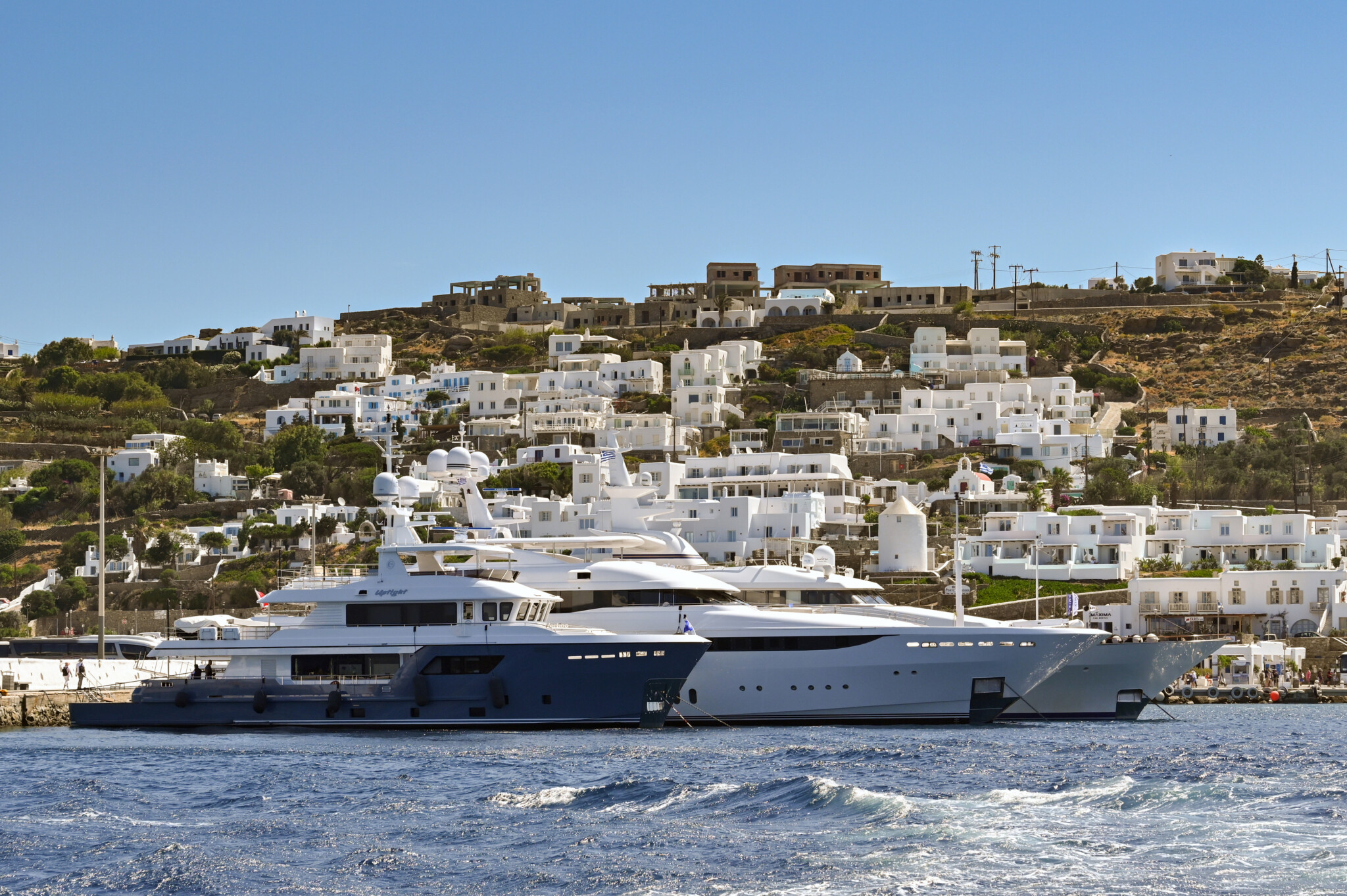 Luxury yachts docked in Mykonos harbour