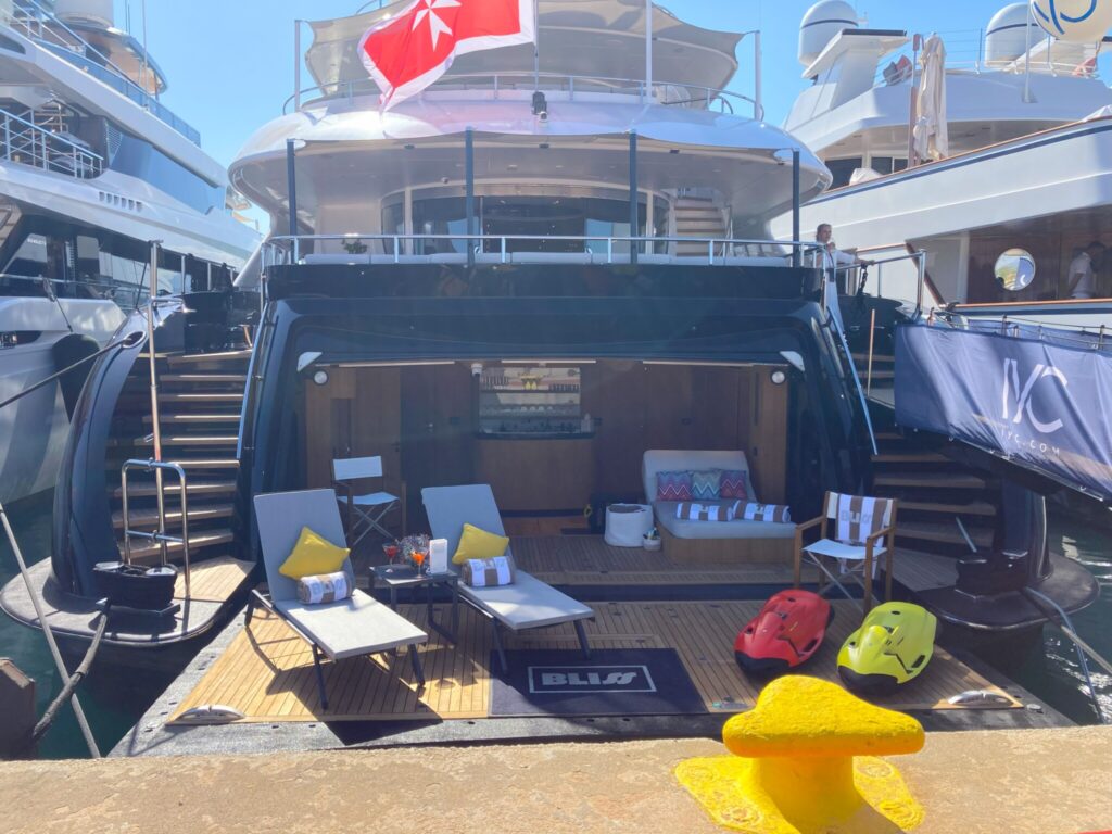 The 144-foot Heesen Luxury Motor Yacht, Bliss, utilizes its "garage" as a bar with its fold down swim platform for a lounge area and launching spot for its water toys
