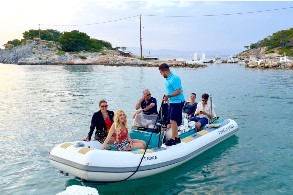 Guests from motor yacht ANKA arriving by tender at the Aponissos beach bar, Agistri, May 2025