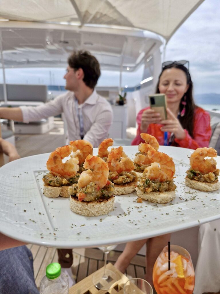 M/Y MILOS AT SEA serves Prawns on Taramasalata Juicy grilled prawns served on crisp bread rounds with a savory layer of taramasalata—classic flavors with a gourmet twist.