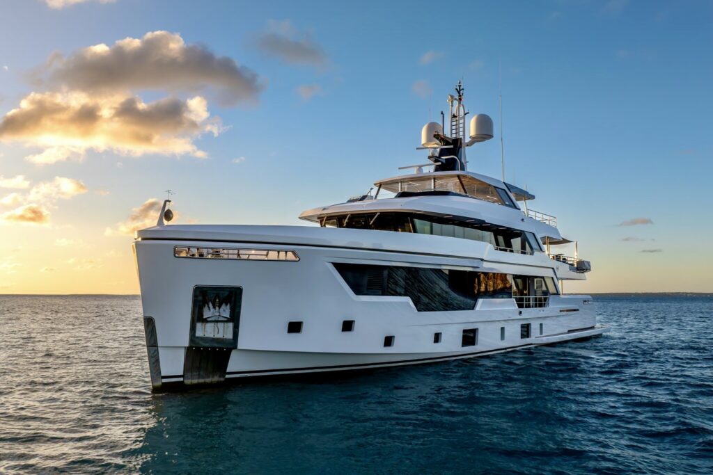 Luxury motor yacht EMOCEAN at anchor at golden hour