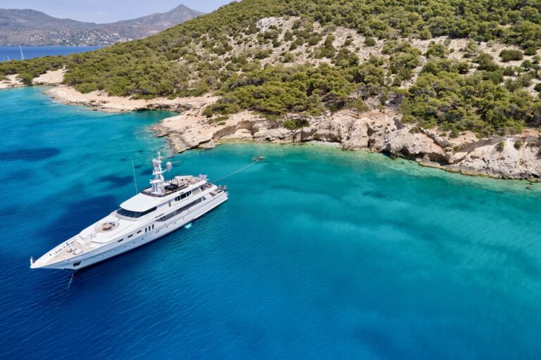 Luxury yacht charter in Greece, Invader anchored stern to Greek Island