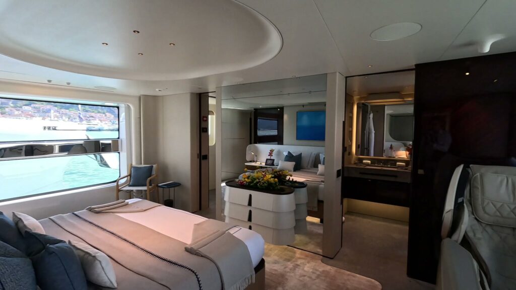 The master cabin with its large hull window on the 125 ft Azimut motor yacht VOLO MARE