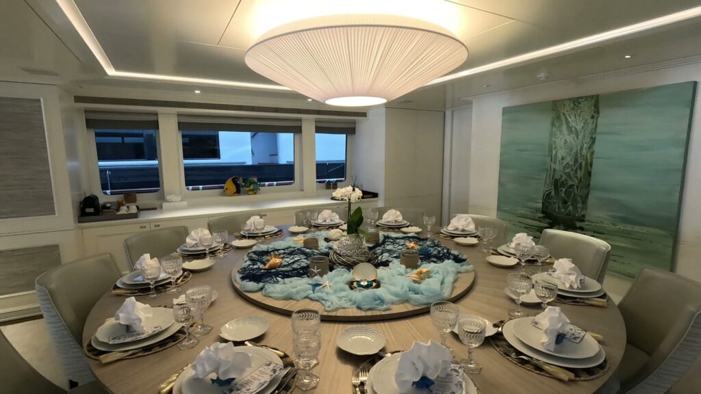 Round dining table with a lazy Susan on Heesen motor yacht IDEFIX II