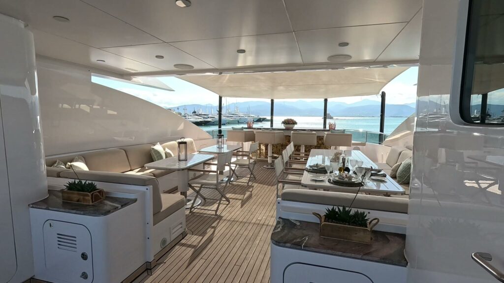 Covered top deck dining and lounge on Heesen motor yacht IDEFIX II