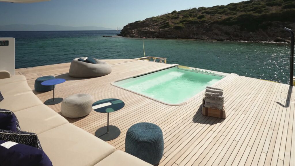 The plunge pool and lounge on the aft deck of the 50 metre ADA motor yacht LEGASEA, at anchor off a Greek island