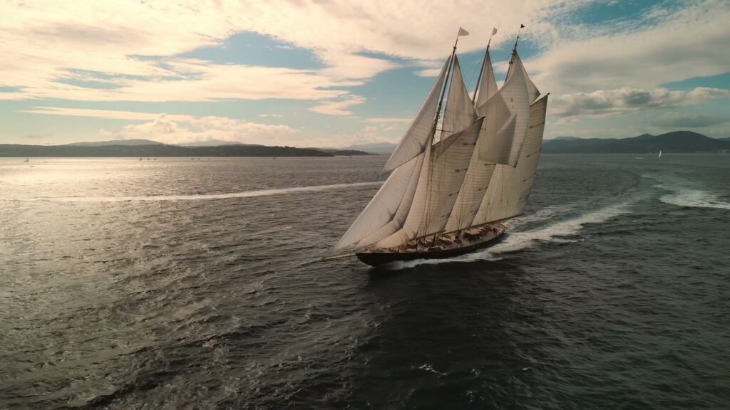 Schooner ATLANTIC heeling under a full press of sail, seen from the air