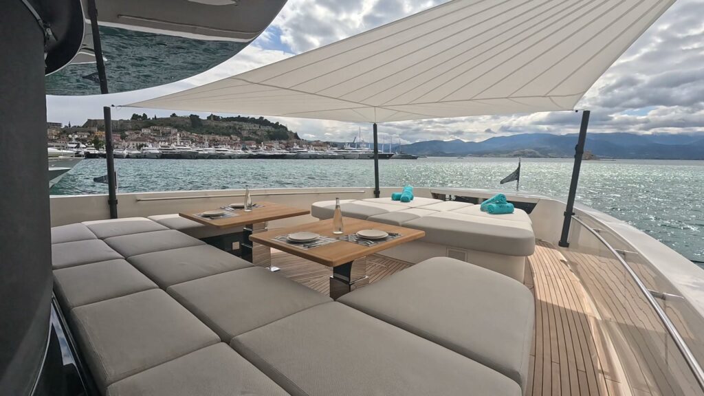 Shaded sun pads and dining table on the Sanlorenzo SP110 BESTIA, off Nafplion