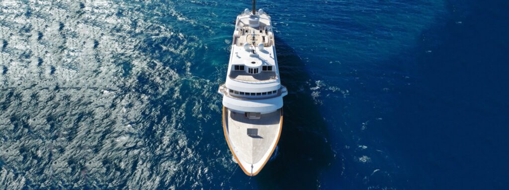 Superyacht seen from directly above cruising the deep blue Aegean on a Greece yacht charter