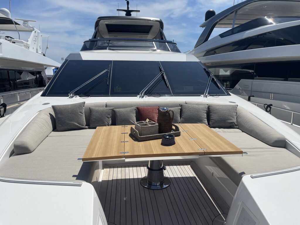 The flybridge lounge and dining table on motor yacht AKASTI, a 2024 Sanlorenzo, May 2025.
