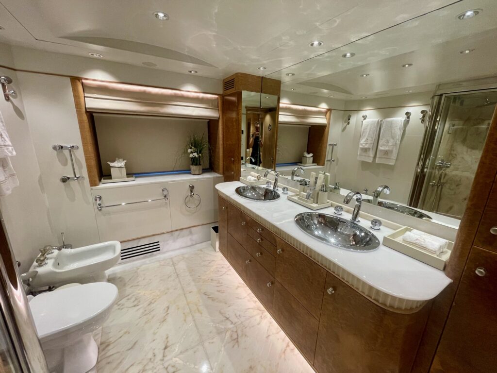 ARTEMISEA's master bathroom with twin basins and a marble floor