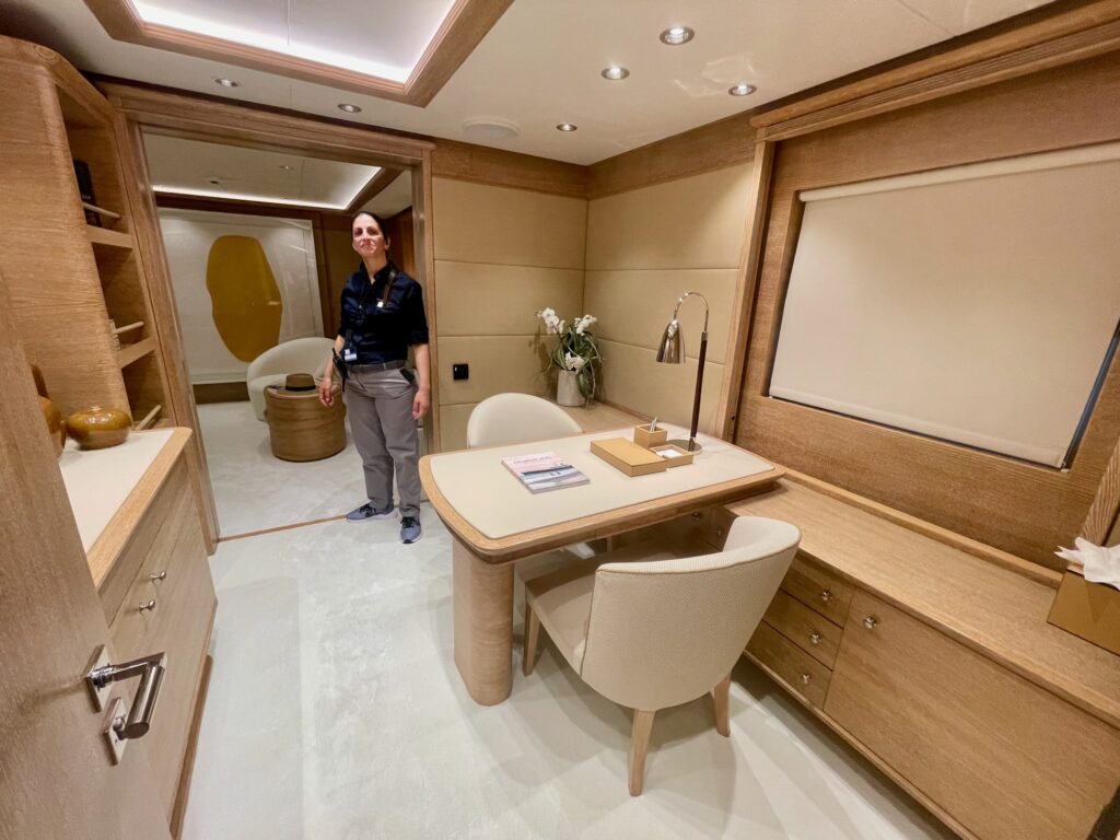 The study in ARTEMISEA's master cabin with a crew member at the door