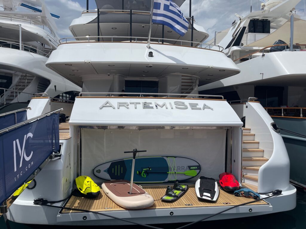 ARTEMISEA's stern at the MEDYS show with the water toys laid out on the swim platform