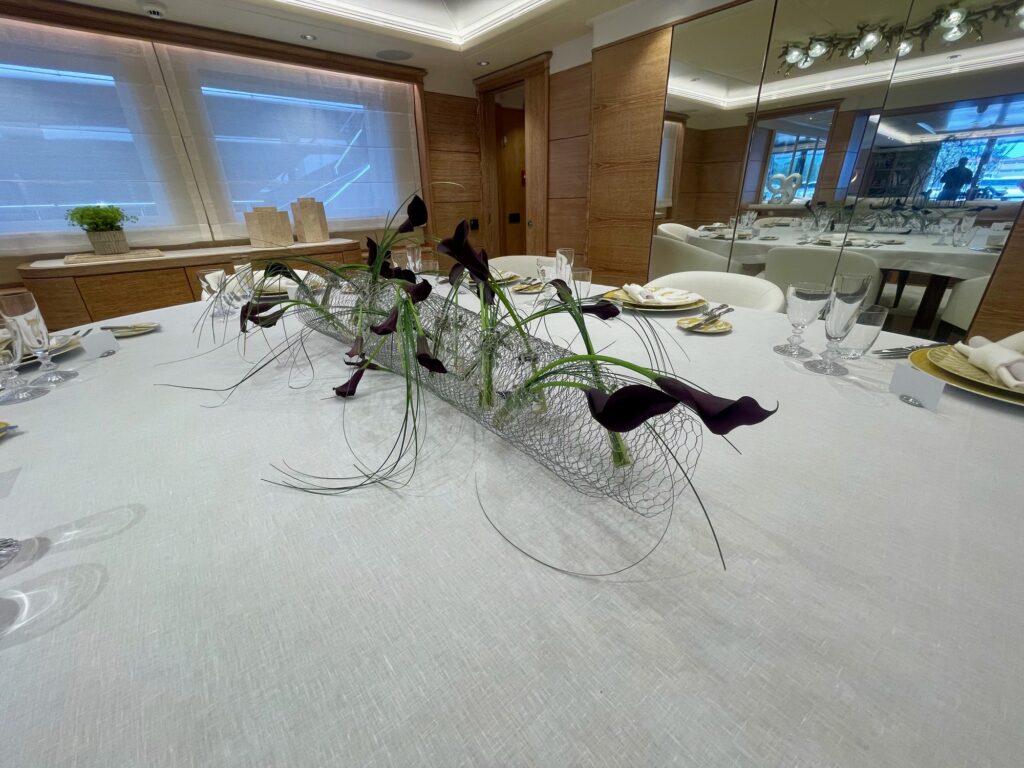 Black calla lily centrepiece on ARTEMISEA's dining table