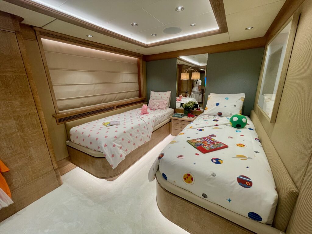 A twin guest cabin on ARTEMISEA made up with children's bedding