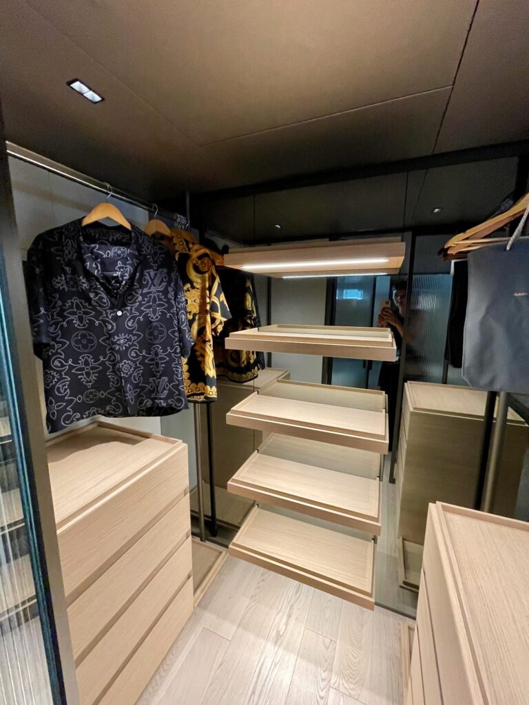 The walk-in wardrobe in BESTIA's master cabin