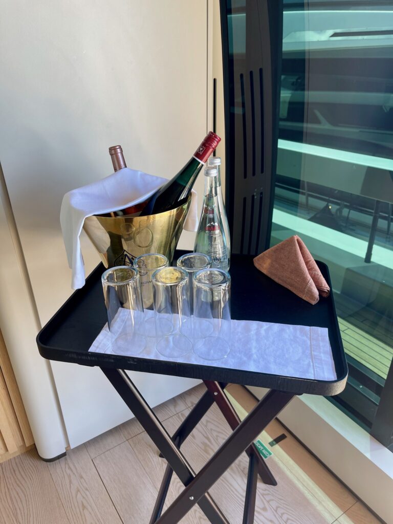 A champagne bucket and glasses on a tray on BESTIA's aft deck