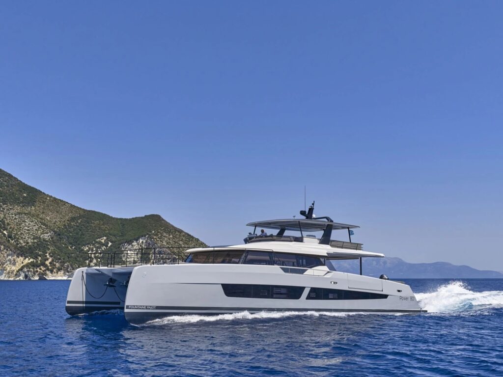 CHRISTAL MIO 80, a 2026 79 ft Fountaine Pajot power catamaran for twelve guests, under way off the Greek coast