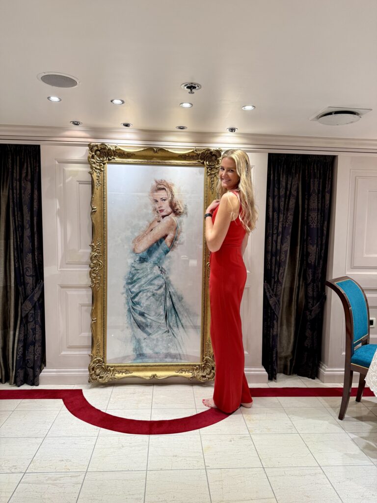CHRISTINA O, the gilt-framed portrait at the end of the red carpet in the ballroom