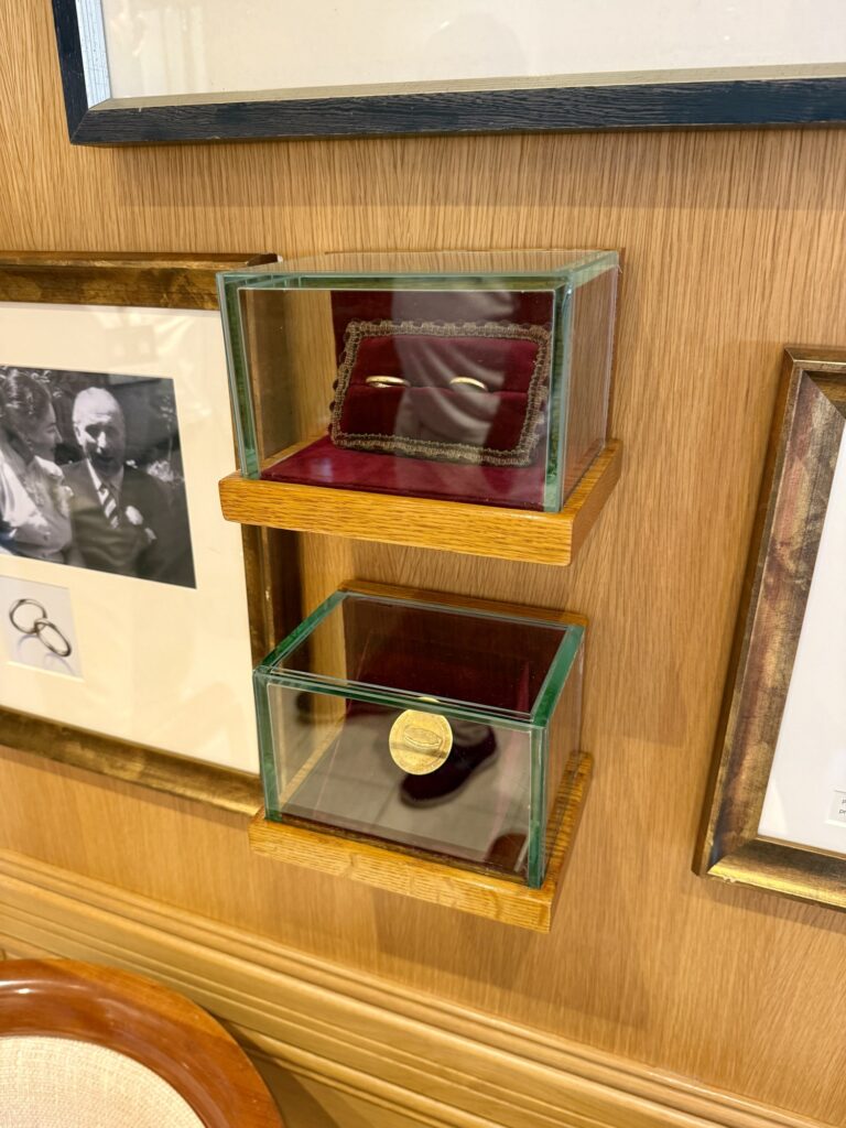 CHRISTINA O, the memorabilia case and photographs in the lounge