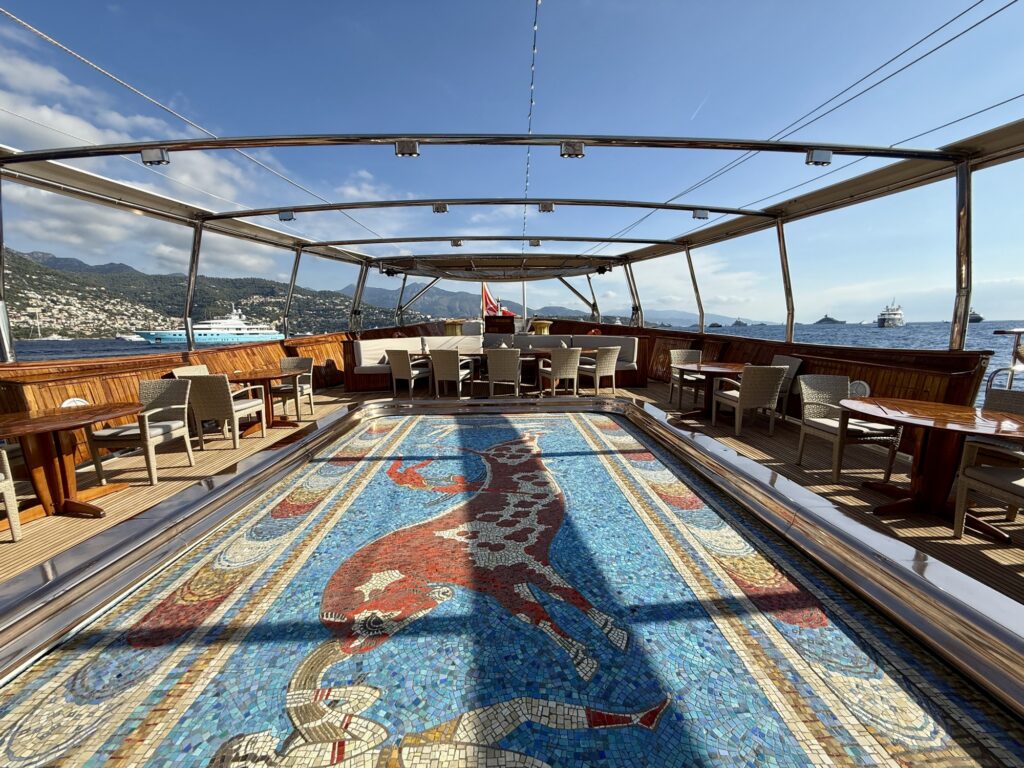 CHRISTINA O, the mosaic pool floor raised to deck level