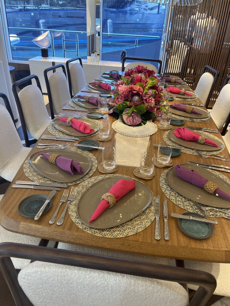 The dining table set for dinner on motor yacht ETERNAL SPARK, April 2025.