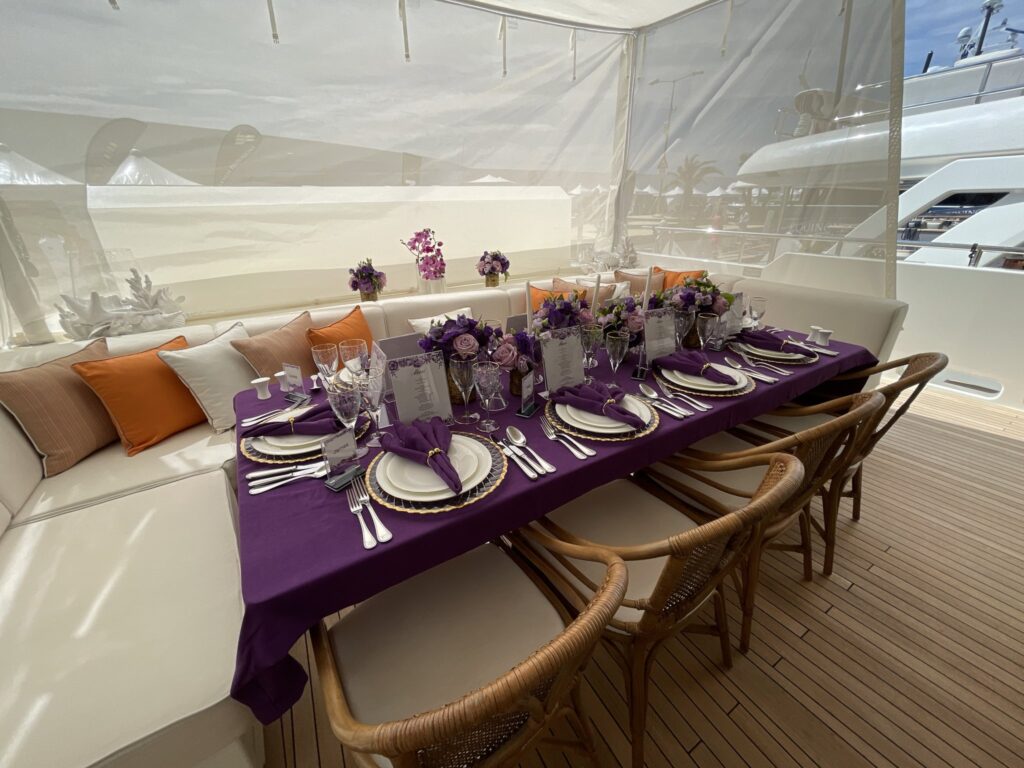 The aft deck dining table set for guests on motor yacht LADY LUNA, April 2026.