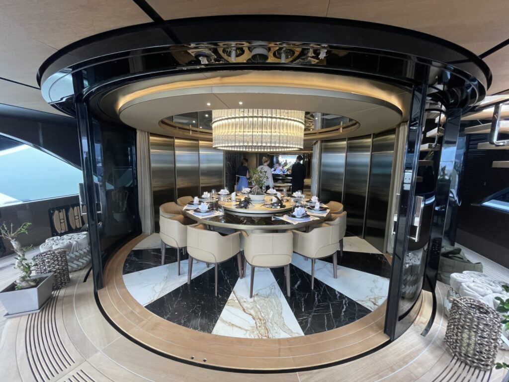 The round dining room on motor yacht RAJA 2, April 2026.