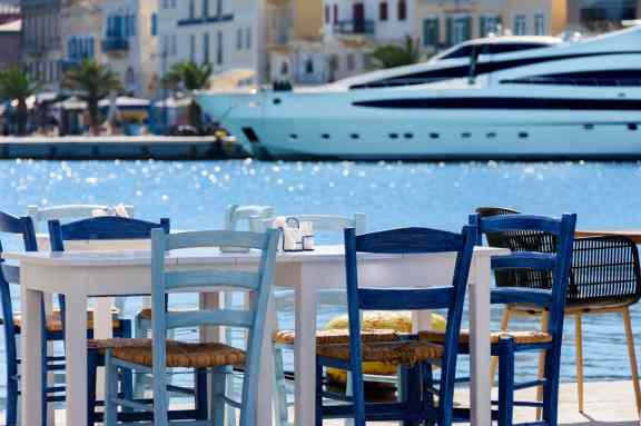 A tavern without customers on the waterfront. Syros Island, Cyclades, Greece