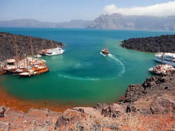 Approach to Nea Kameni via the bay on North-East. Gets crowded from 10am to 4pm. Off main season, we do stay for the night.