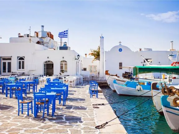The village of Naousa in Paros - a great example of how universal the smaller Cycladic islands are. Stop by for a Greek coffee, have a snack and observe the flow of life - the fishermen, the cats, the women, the blue and white buildings...
