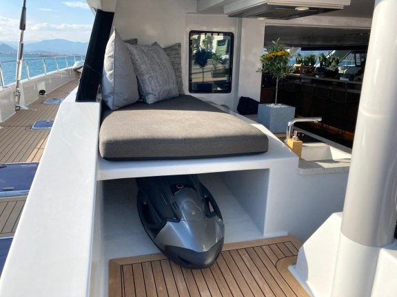 Seabob is easily stored underneath seating on Catamaran Sameli