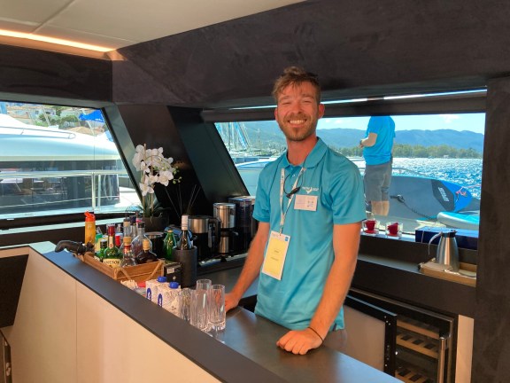 Bartender Spyros on Catamaran Moon Light behind the bar