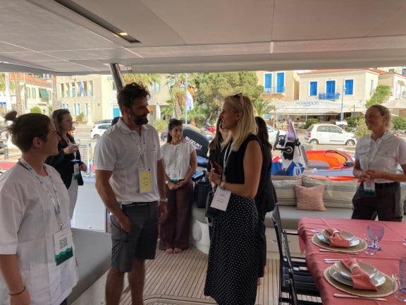 Our Broker Sarah Klische talking to the Crew onboard Catamaran Namaste at the East Med Yacht Show 2024