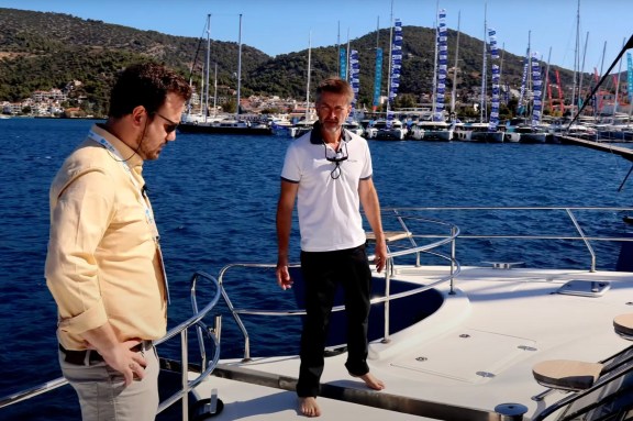 Tour of the Foredeck Onboard Power Catamaran Skylark: Charter Broker Alex Hailwax (on the left) talks to Captain Jez Flecher of Skylark at the EMMYS 2024 in Poros