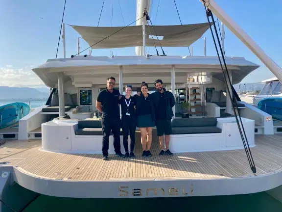 Crew standing on the back deck of Catamaran Sameli showing the yacht at the MEDYS Yacht Show in Nafplion in 2025