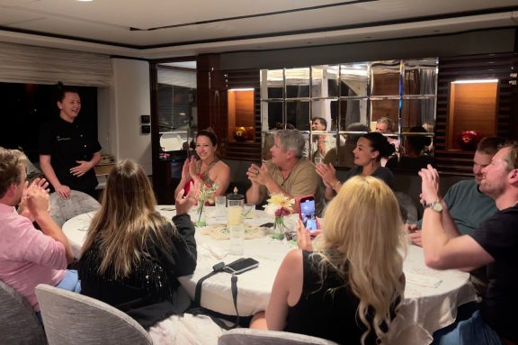 Celebrating the chef after dinner onboard motor yacht ANKA