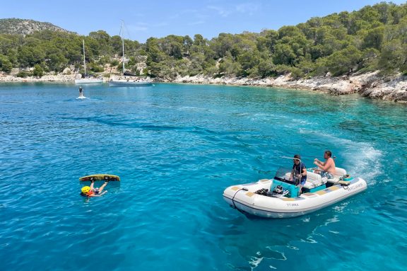 Guests from motor yacht ANKA trying out the wakeboard at Agistri Island