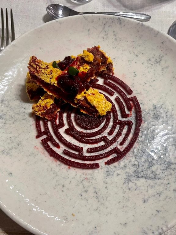 M/Y ANKA serves crispy vegan beetroot patties on a maze of sweet beetroot hummus, topped with tangy mulberry sauce