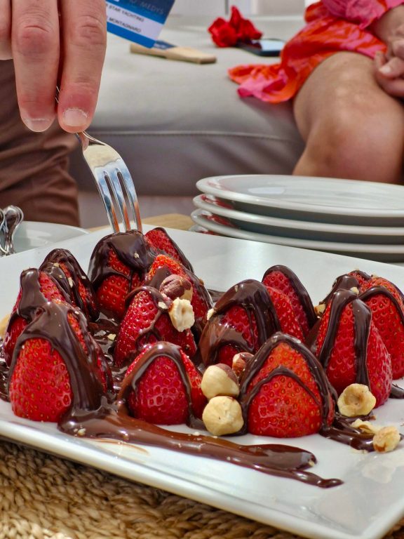 M/Y MILOS AT SEA serves Strawberries & Chocolate Fresh strawberries drizzled with rich dark chocolate and topped with toasted hazelnuts—simple, bold, and totally irresistible.