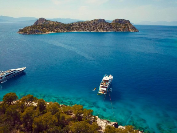 Motor yacht ANKA anchored and tied stern to at Agistri Island, Greece