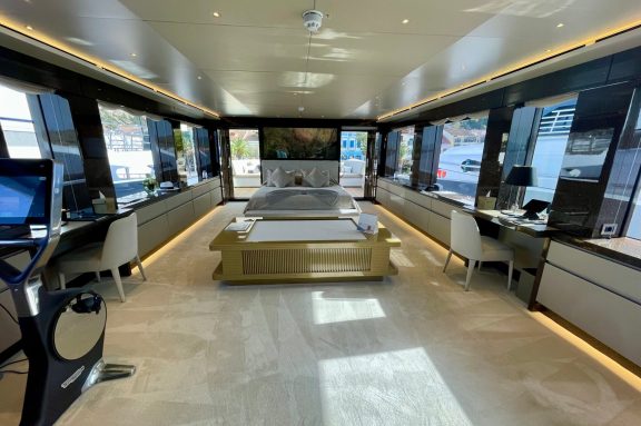 Greek Superyacht MY EDEN Master Cabin with access to a private forward-facing balcony with Jacuzzi and aft deck dining area.