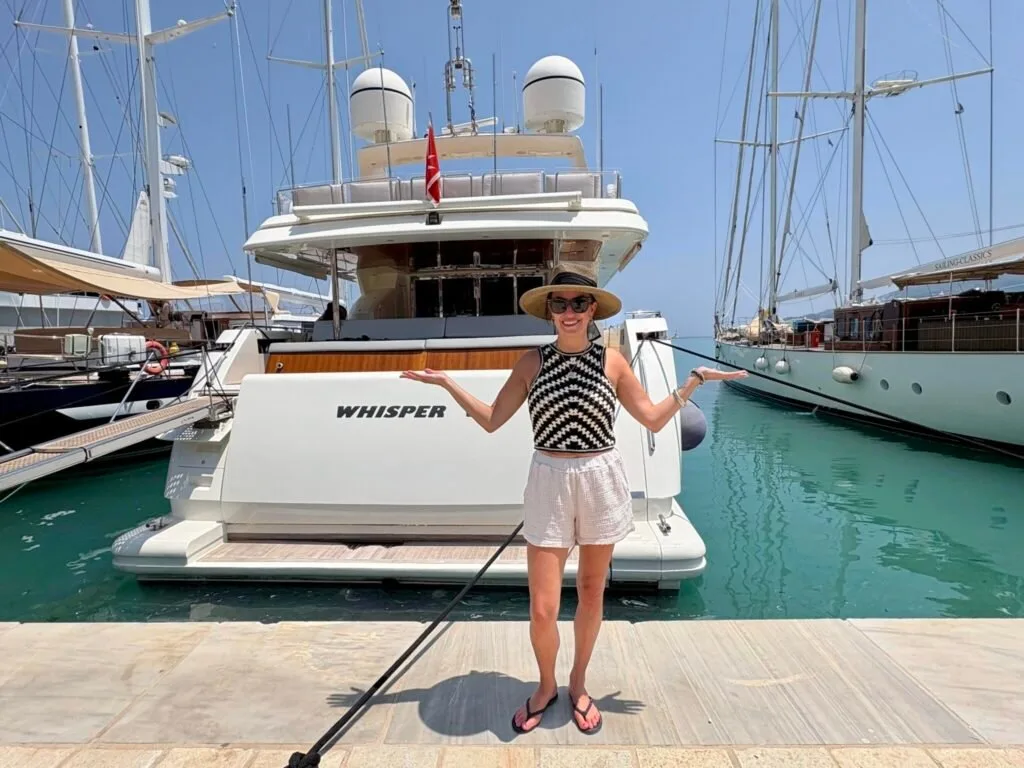 Guest in front of yacht WHISPER