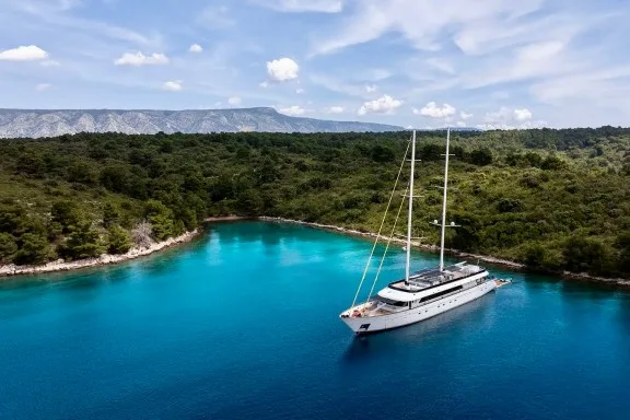 Crewed sailing yacht ANIMA MARIS at anchor in Greece.