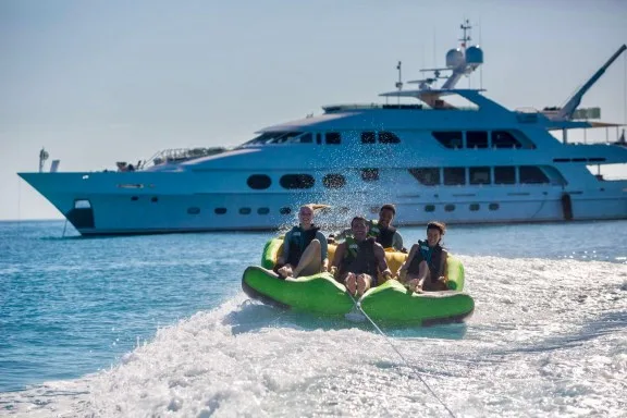 Greece yacht charter LADY JOY - guests on towable 2