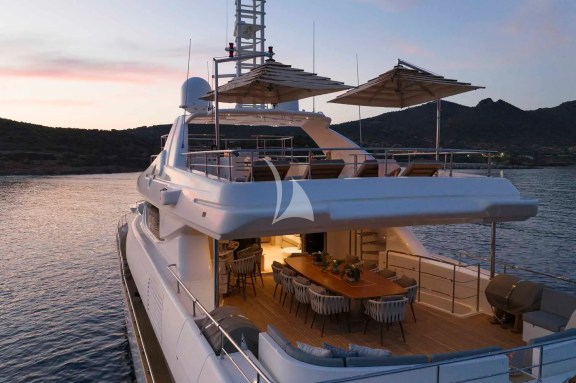 The Upper Deck veranda has a large dining table, a bar and a large sofa